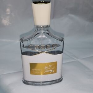Creed Aventus for Her with Gold and White Accents
